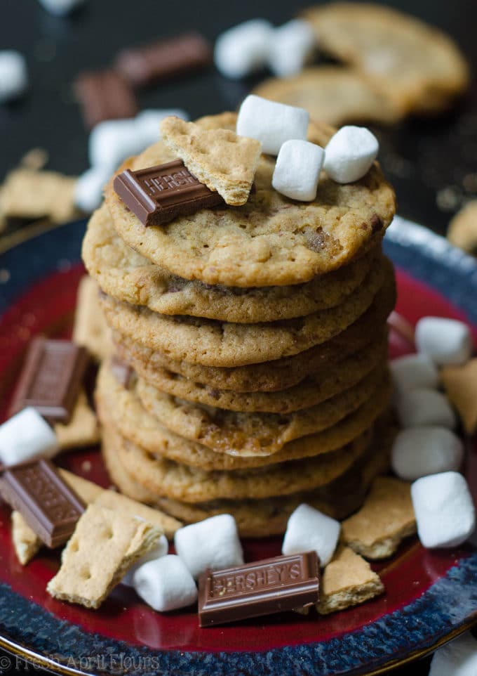 S'mores Cookies: Classic milk chocolate chip cookies scattered with gooey marshmallows and crunchy graham cracker crumbs.