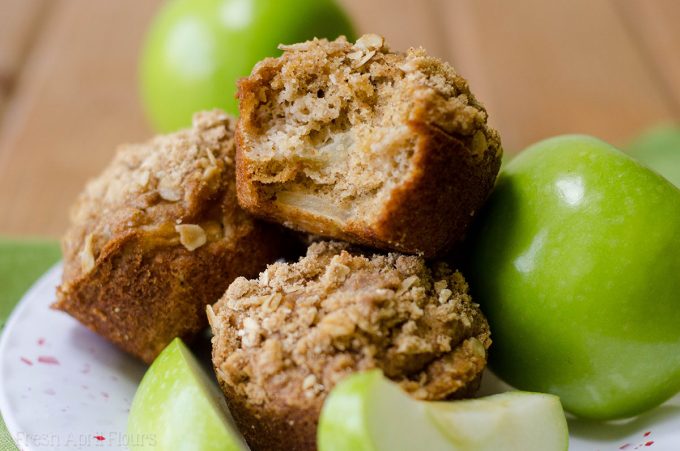 Apple Cinnamon Oat Streusel Muffins: Moist and tender muffins full of tart, chunky apples and topped with a melt-in-your-mouth cinnamon and oat streusel. A great staple muffin recipe for fall!