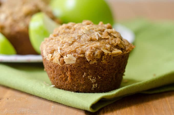 Apple Cinnamon Oat Streusel Muffins: Moist and tender muffins full of tart, chunky apples and topped with a melt-in-your-mouth cinnamon and oat streusel. A great staple muffin recipe for fall!