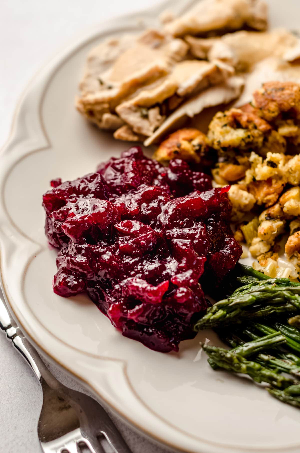spiced cranberry sauce on a plate with thanksgiving sides