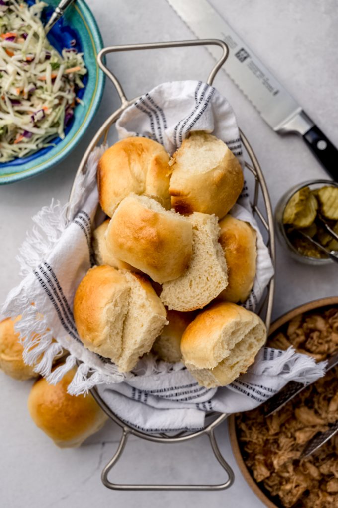 Aerial photo of a basket of slider rolls.