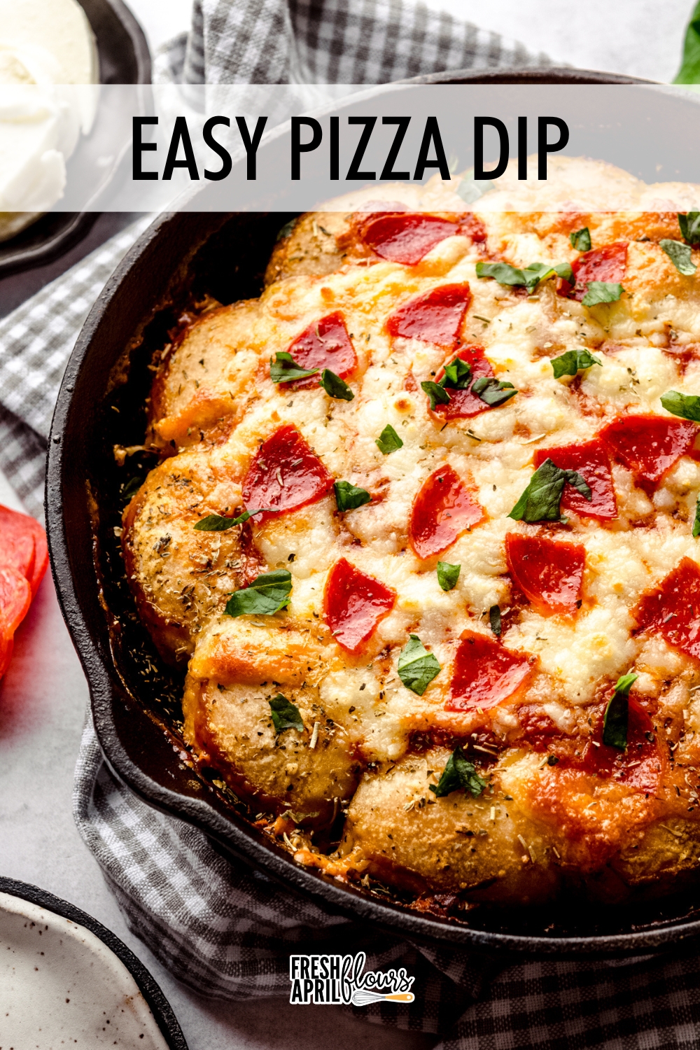 This hot pizza dip made with cream cheese is baked with built-in seasoned bread dippers. Feel free to add your favorite toppings! via @frshaprilflours