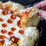 Skillet Pizza Dip: Ditch the delivery and prepare your pizza in a skillet with built-in bread! Also includes directions for omitting the rolls.