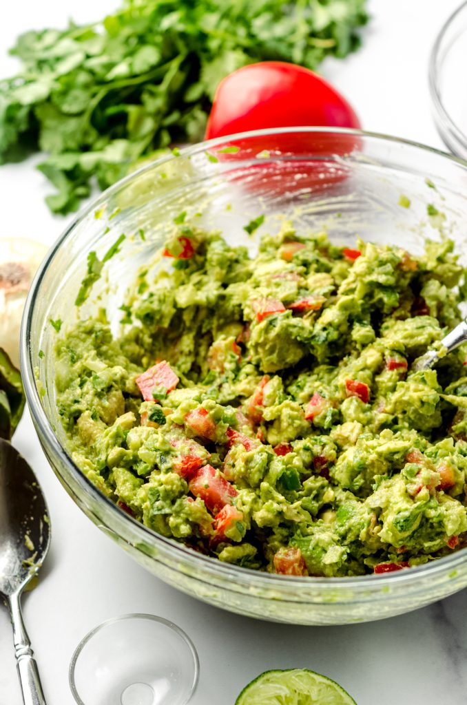 Guacamole in a large glass bowl.