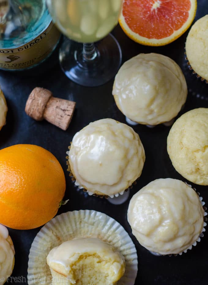 Glazed Mimosa Muffins: Tender citrus muffins made with a champagne reduction and topped with a boozy orange glaze are the sweetest way to get your mimosa fix.