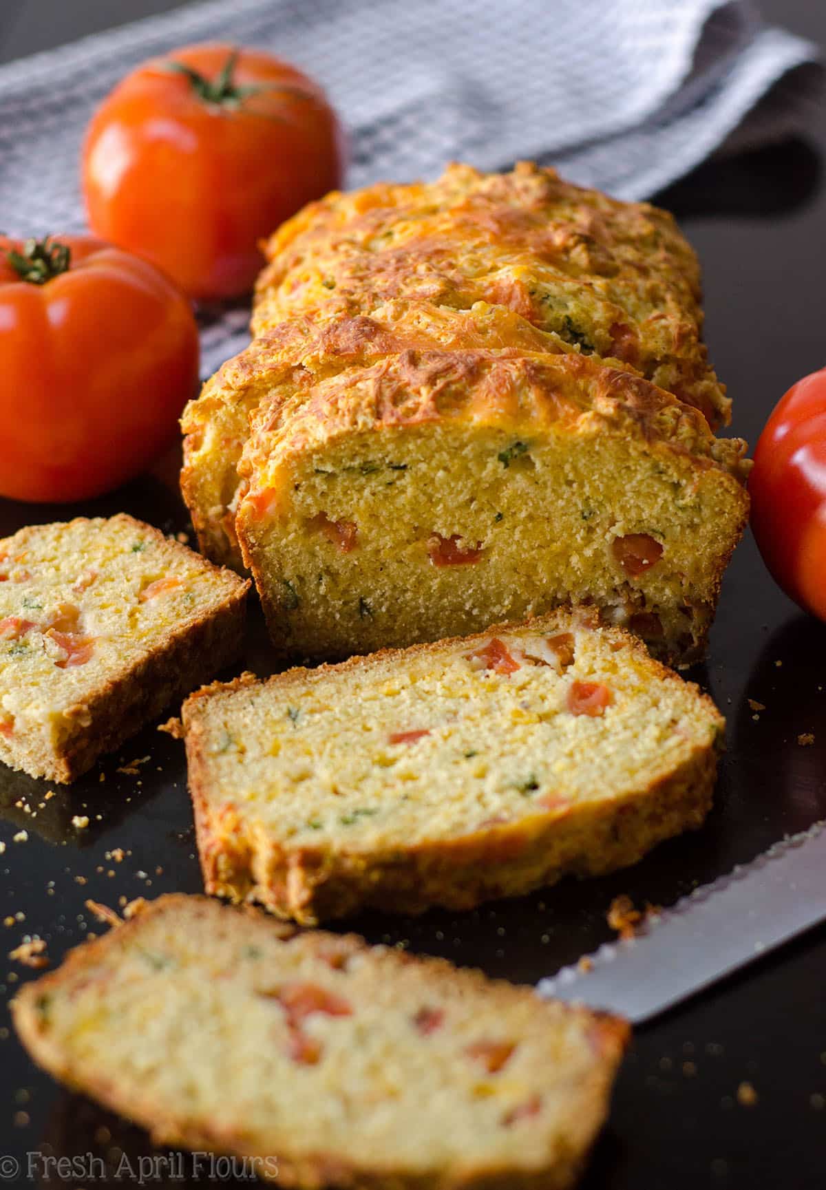 Herbed Tomato Quick Bread: A savory bread that comes together quickly using fresh tomatoes and basil. Perfect for using summer produce!