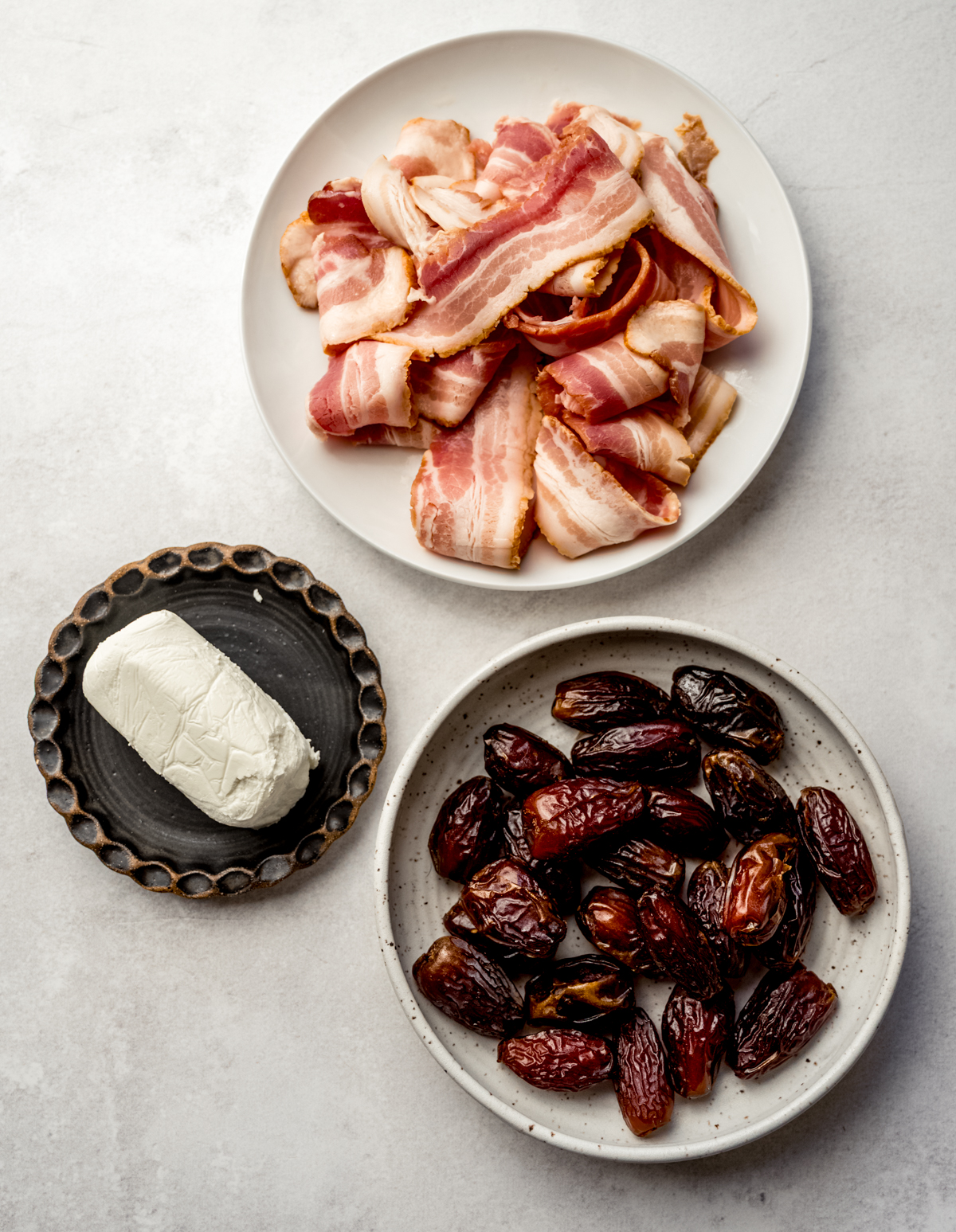 Aerial photo of ingredients to make bacon wrapped dates with goat cheese.