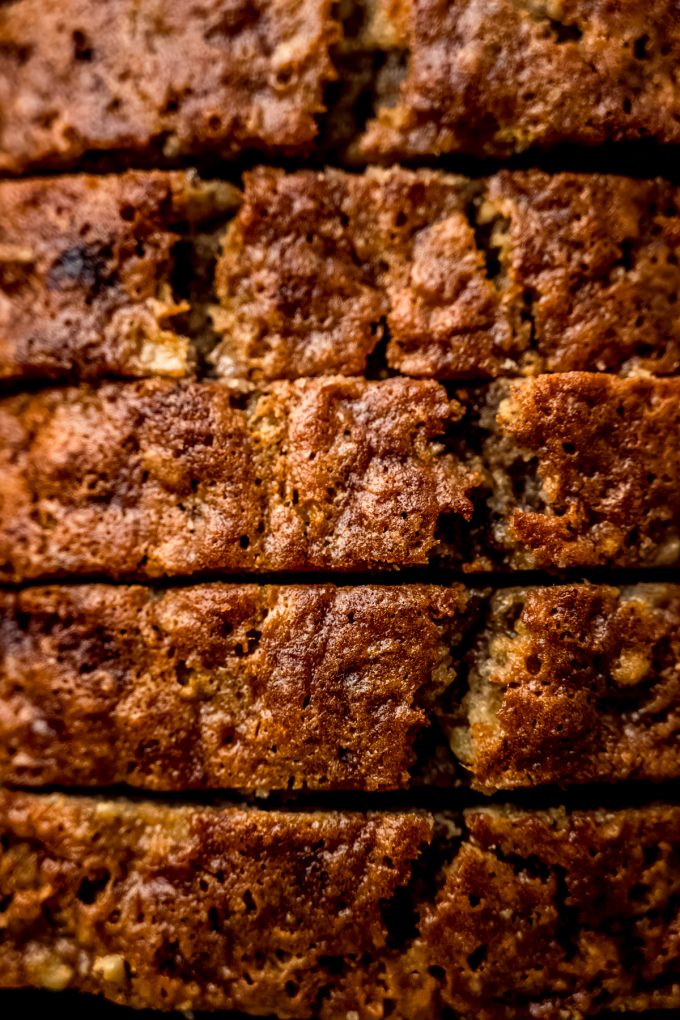 Closeup of slices of banana nut bread in a baking pan.