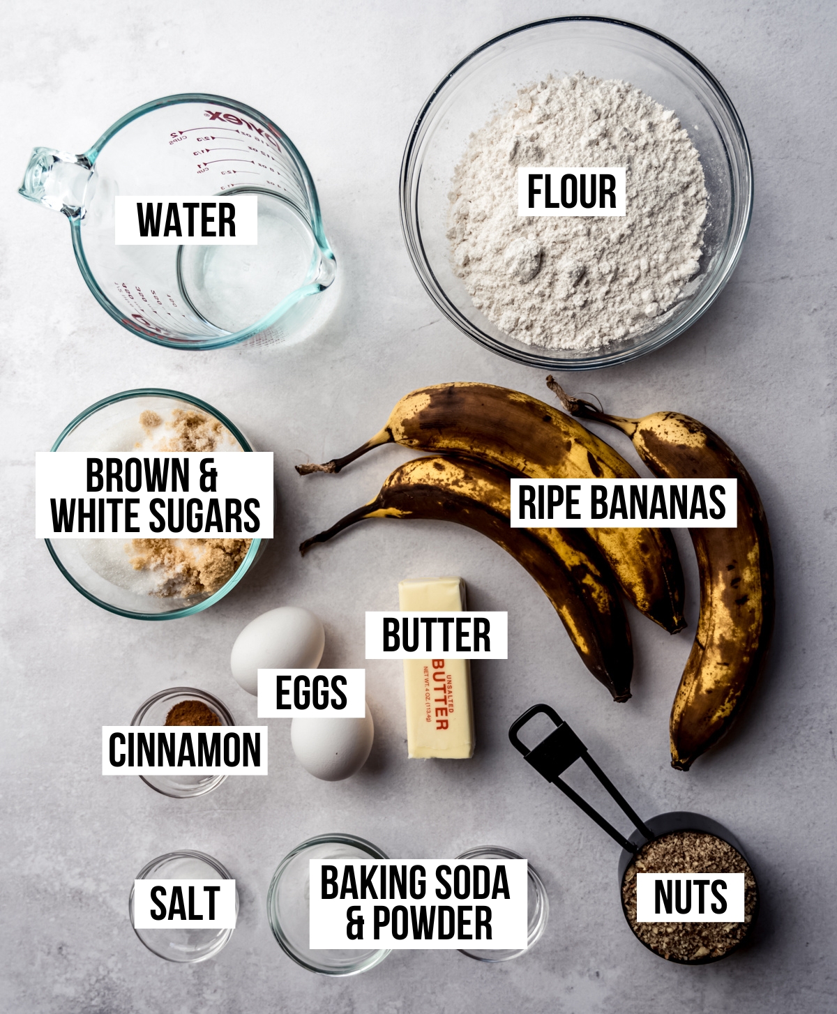 Aerial photo of ingredients to make banana nut bread with text overlay labeling each ingredient.