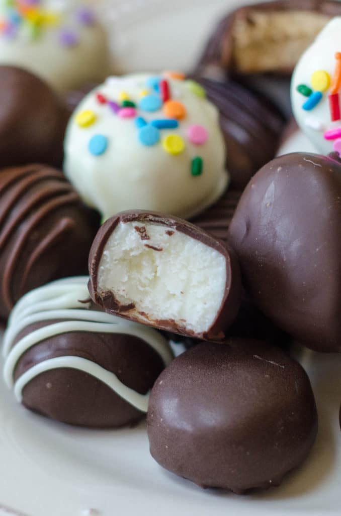 Chocolate Covered Easter Eggs: Making your own buttercream eggs from scratch is MUCH easier than you think it is. Classic vanilla, funfetti, coconut cream, and peanut butter eggs or rounds dipped in chocolate are just what your Easter needs!