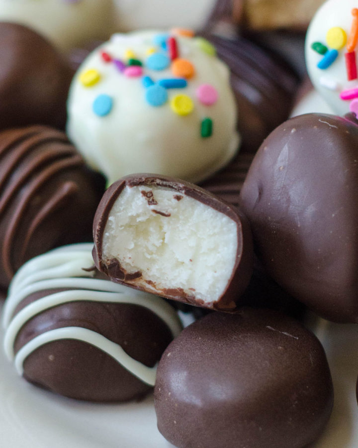 Chocolate Covered Easter Eggs: Making your own buttercream eggs from scratch is MUCH easier than you think it is. Classic vanilla, funfetti, coconut cream, and peanut butter eggs or rounds dipped in chocolate are just what your Easter needs!