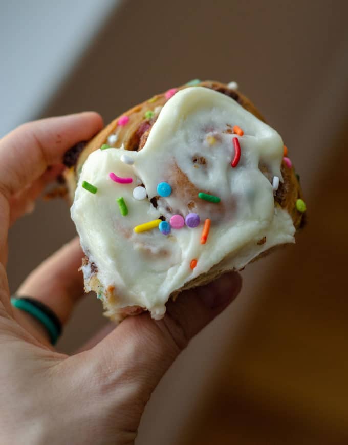 Funfetti Cinnamon Rolls: Simple yeast rolls filled with sweet and gooey cinnamon and studded with sprinkles. Spread with easy cream cheese frosting for an indulgent breakfast or treat!