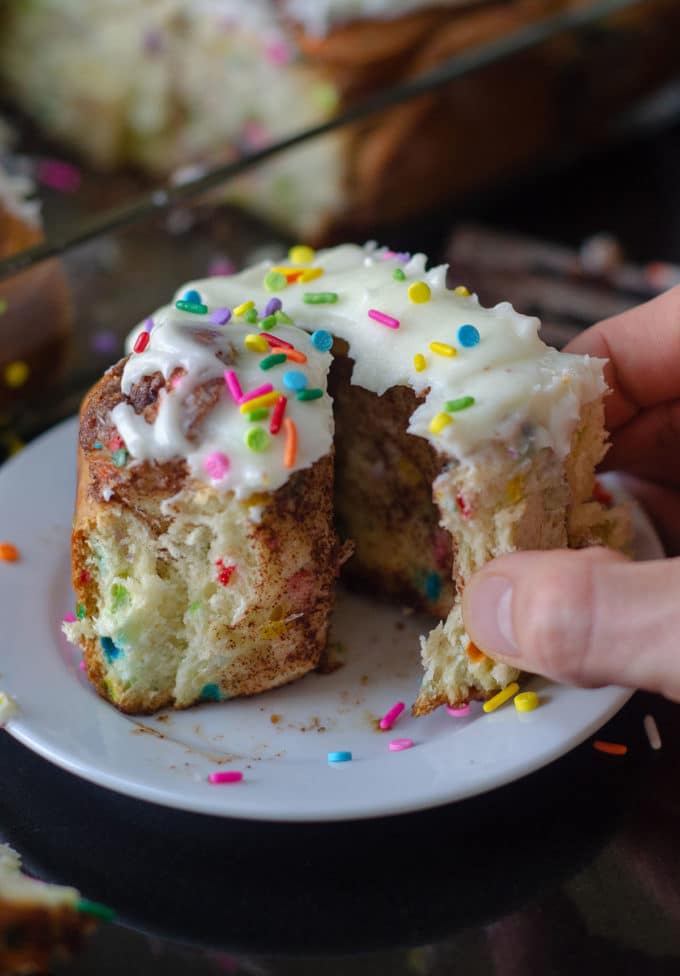 Funfetti Cinnamon Rolls: Simple yeast rolls filled with sweet and gooey cinnamon and studded with sprinkles. Spread with easy cream cheese frosting for an indulgent breakfast or treat!
