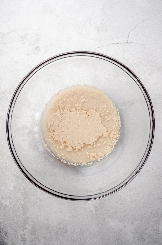 Aerial photo of proofed yeast in a large glass bowl.