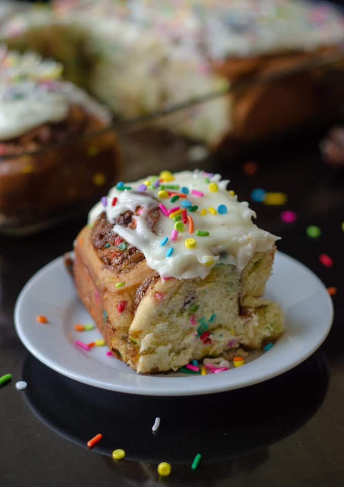 Funfetti Cinnamon Rolls: Simple yeast rolls filled with sweet and gooey cinnamon and studded with sprinkles. Spread with easy cream cheese frosting for an indulgent breakfast or treat!