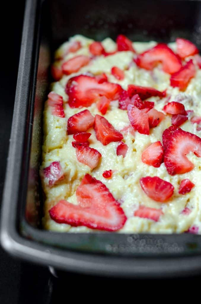 strawberry lemonade quick bread in a loaf pan ready to bake
