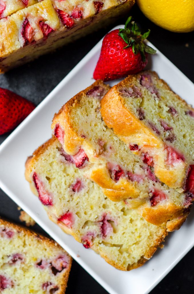 slices of strawberry lemonade quick bread on a white plate