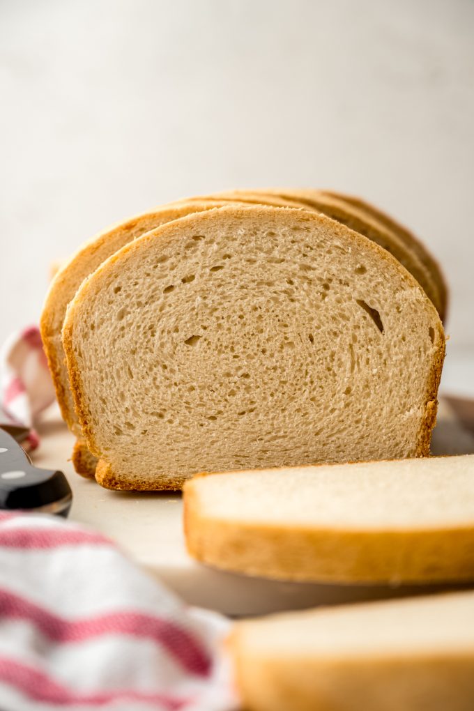 Sliced sandwich bread on a surface.