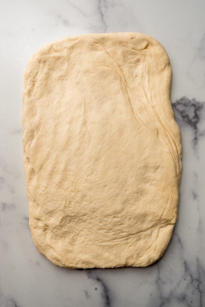 Yeast bread dough pressed into a rectangle.