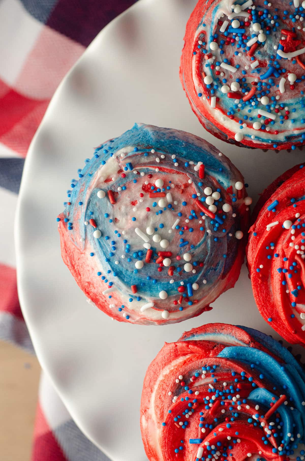 Red, White, & Blue Swirl Cupcakes: Beautifully swirled cupcakes that taste as great as they look! Perfect for any patriotic celebration or any time you want some American pride in your dessert.