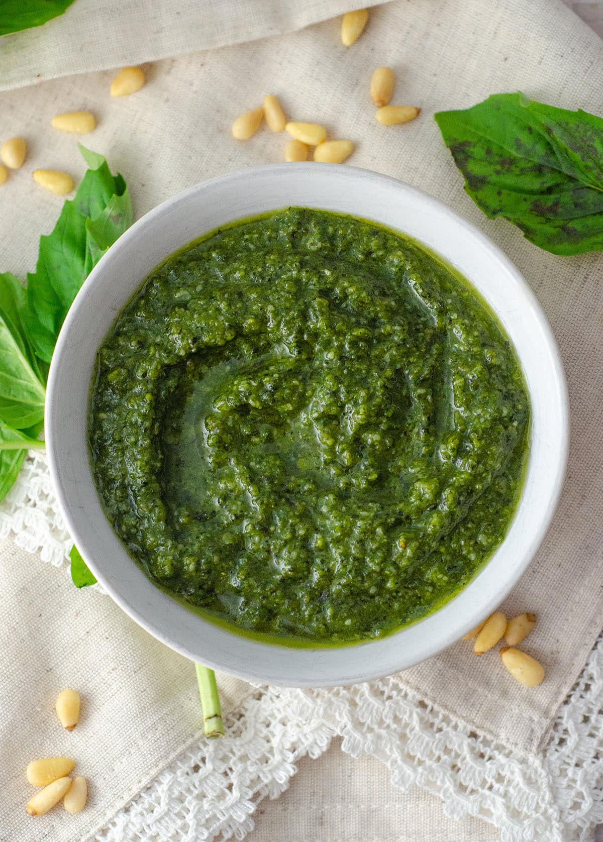 Homemade Pesto: Making your own herby, garlicy pesto at home is as easy as throwing FIVE ingredients into a food processor.