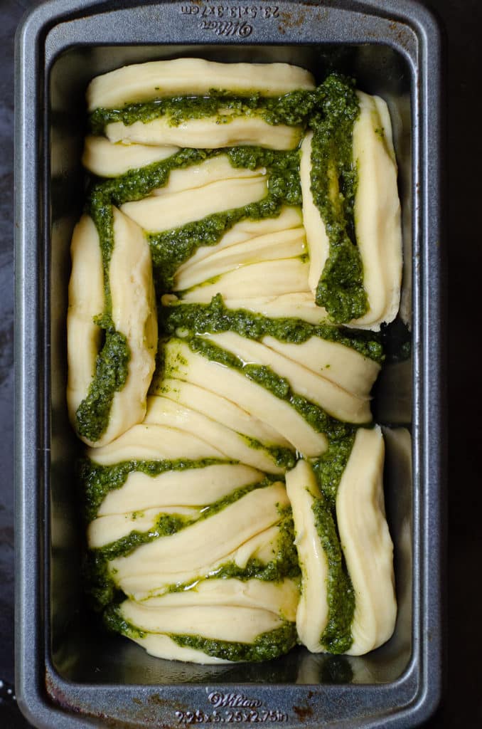 Pull-Apart Pesto Bread: Soft and fluffy pull-apart bread filled with zesty, herbed pesto.