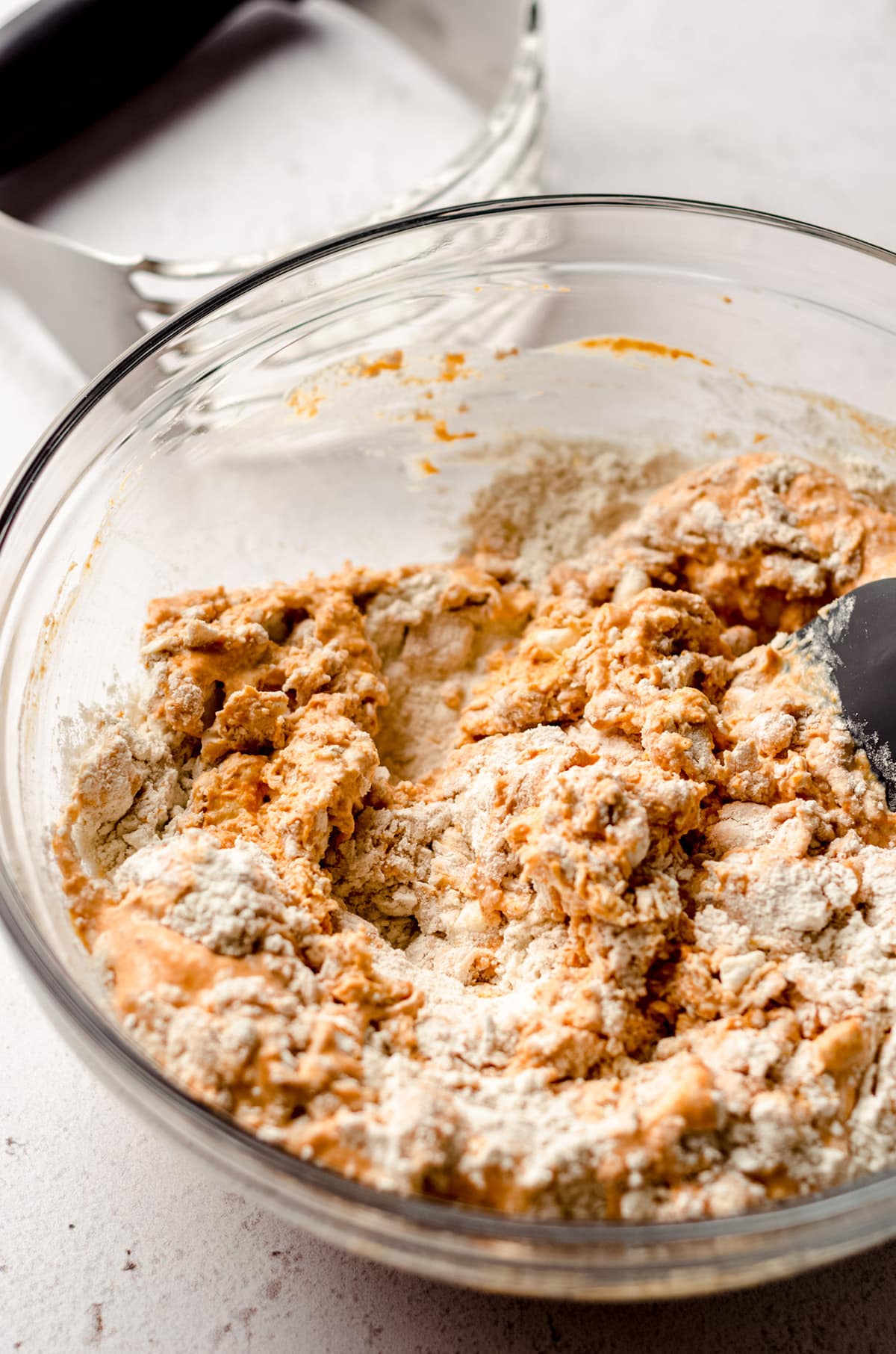 pumpkin biscuit dough in a glass bowl