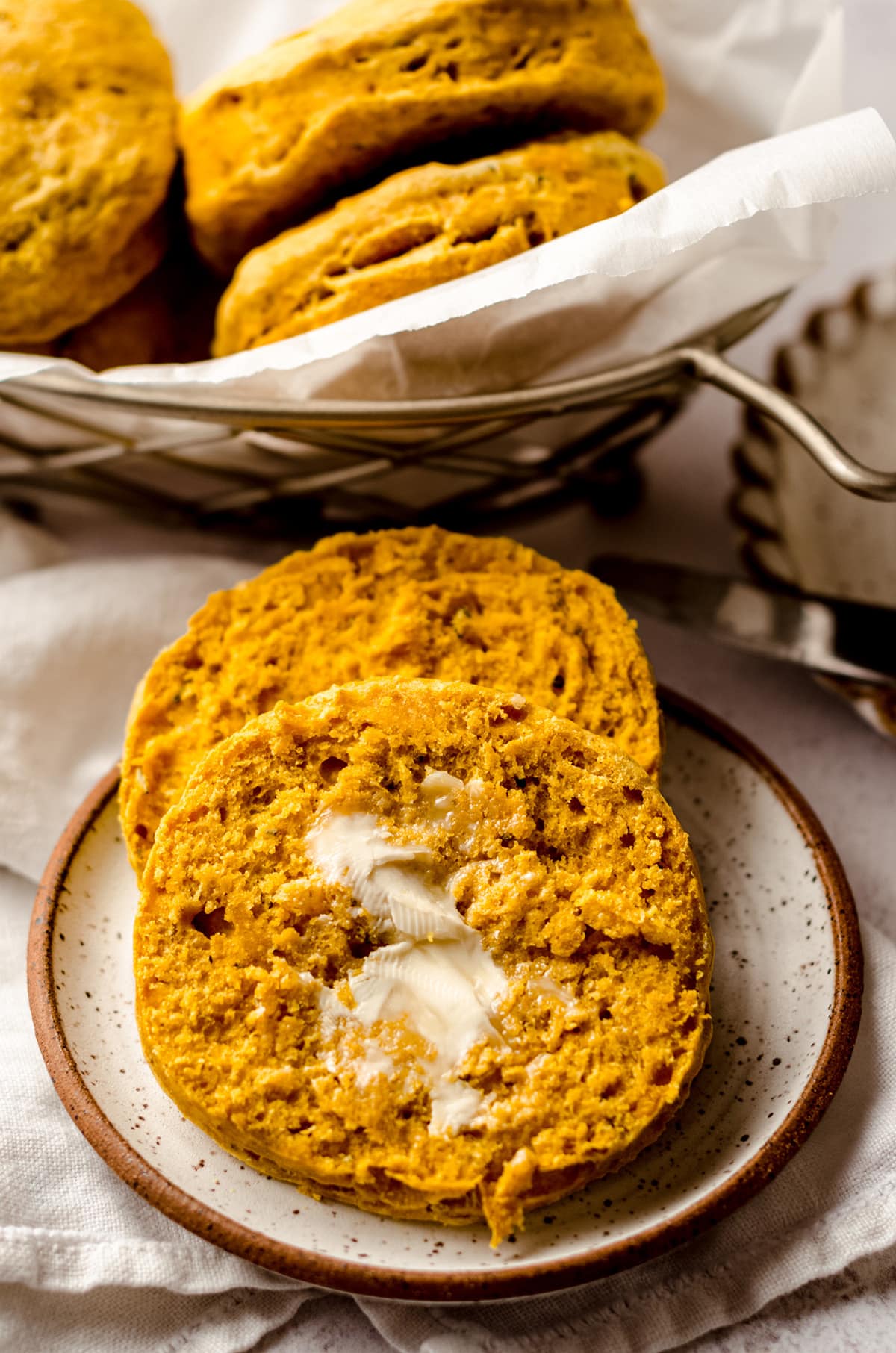 buttered savory pumpkin biscuits on a plate