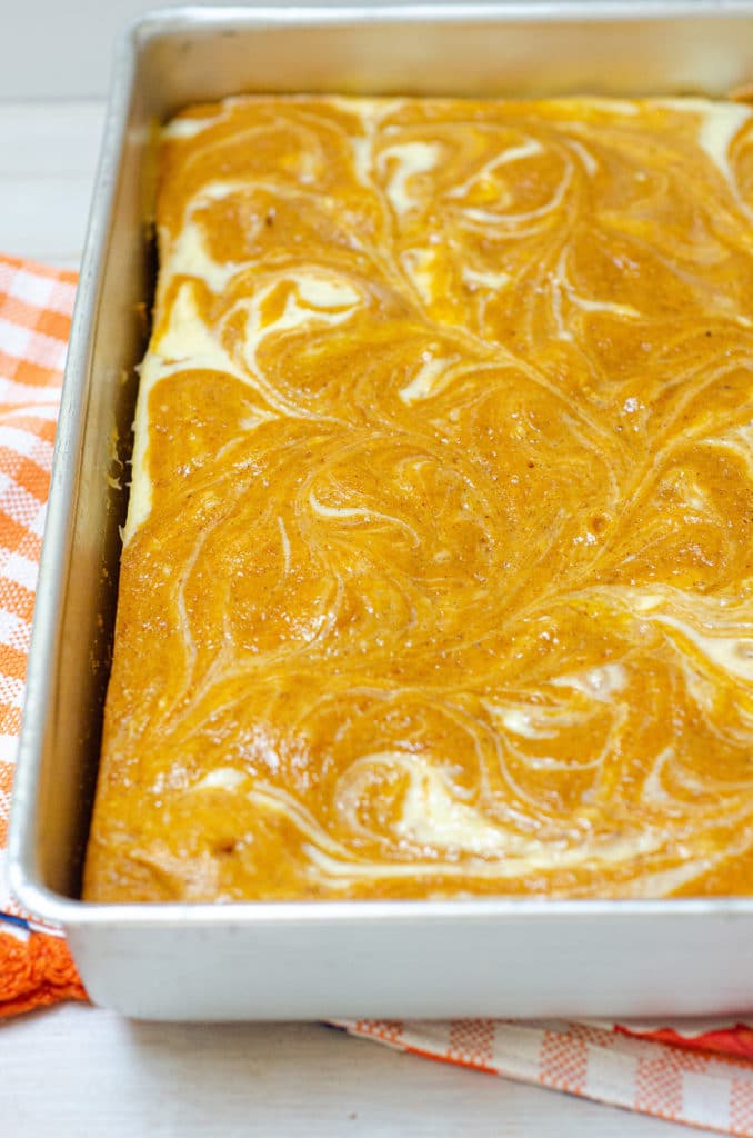 Pumpkin Cheesecake Swirl Sheet Cake: Dense and flavorful pumpkin cake swirled with sweet and creamy cheesecake.