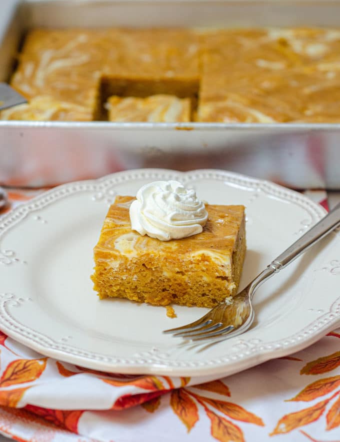 Pumpkin Cheesecake Swirl Sheet Cake: Dense and flavorful pumpkin cake swirled with sweet and creamy cheesecake.