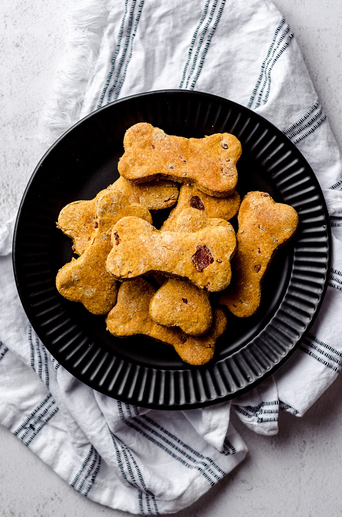 aerial photo of homemade dog treats on a black plate