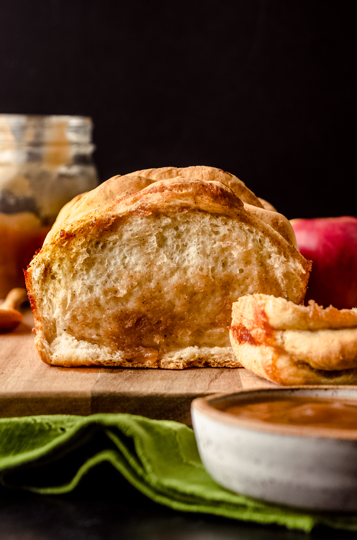 A loaf of apple butter pull-apart bread on a cutting board.