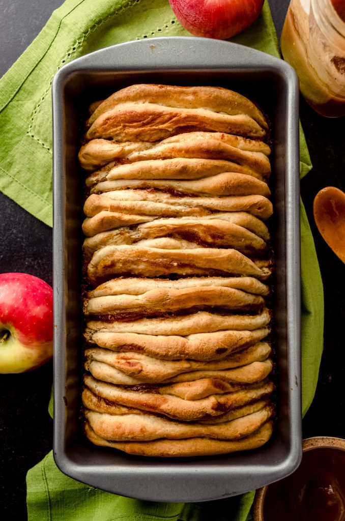 Aerial photo of apple butter pull-apart bread in a pan.