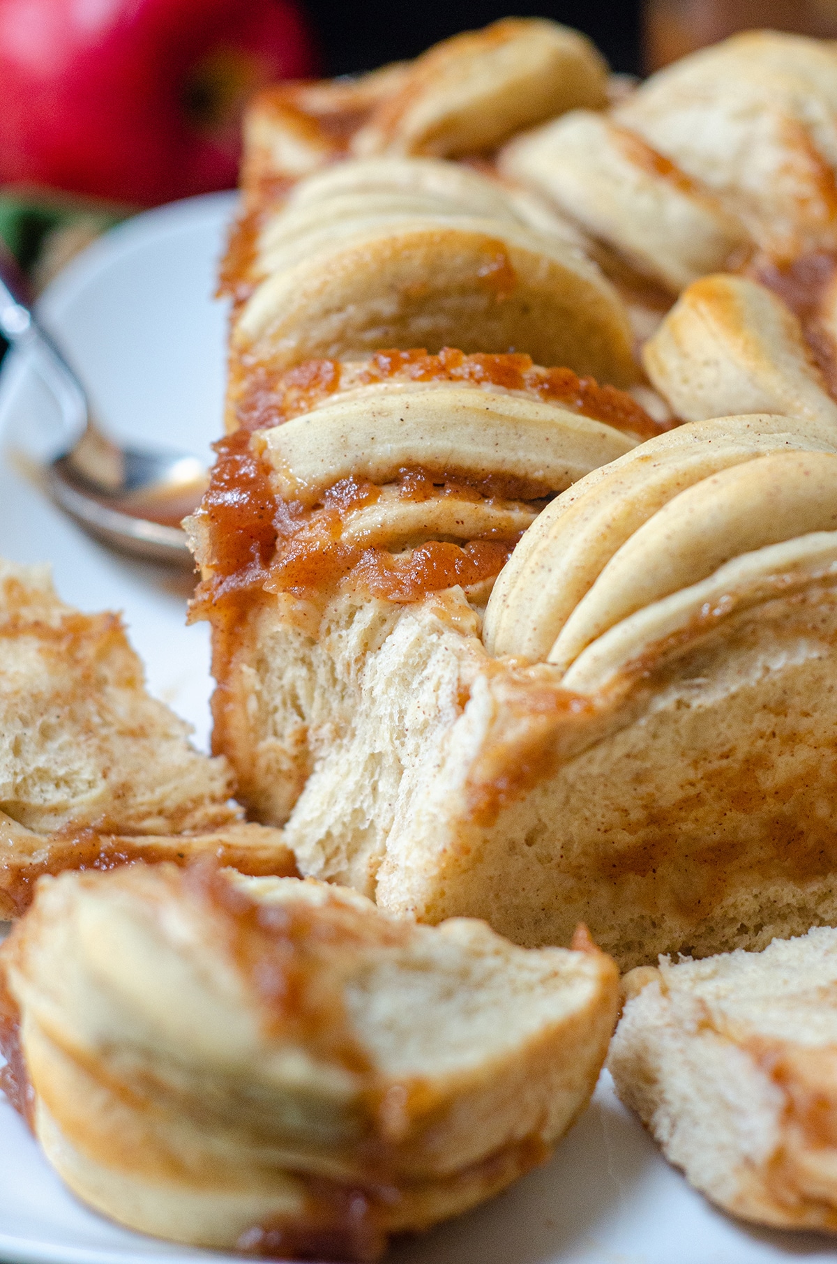 Soft and fluffy pull-apart bread spiced with cinnamon and spread with homemade apple butter. via @frshaprilflours