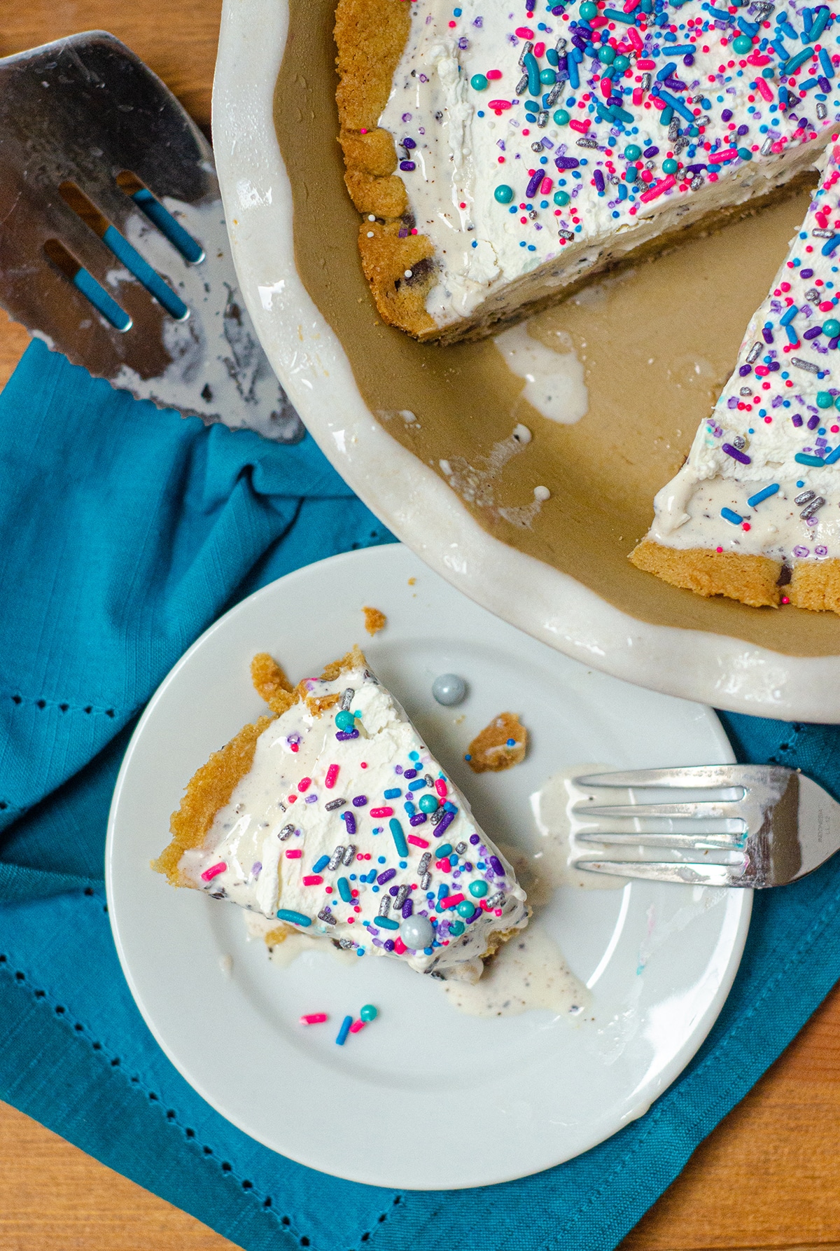 Creamy chocolate chip cookie dough ice cream is the filling for this frozen pie and sits atop a buttery chocolate chip cookie crust. via @frshaprilflours