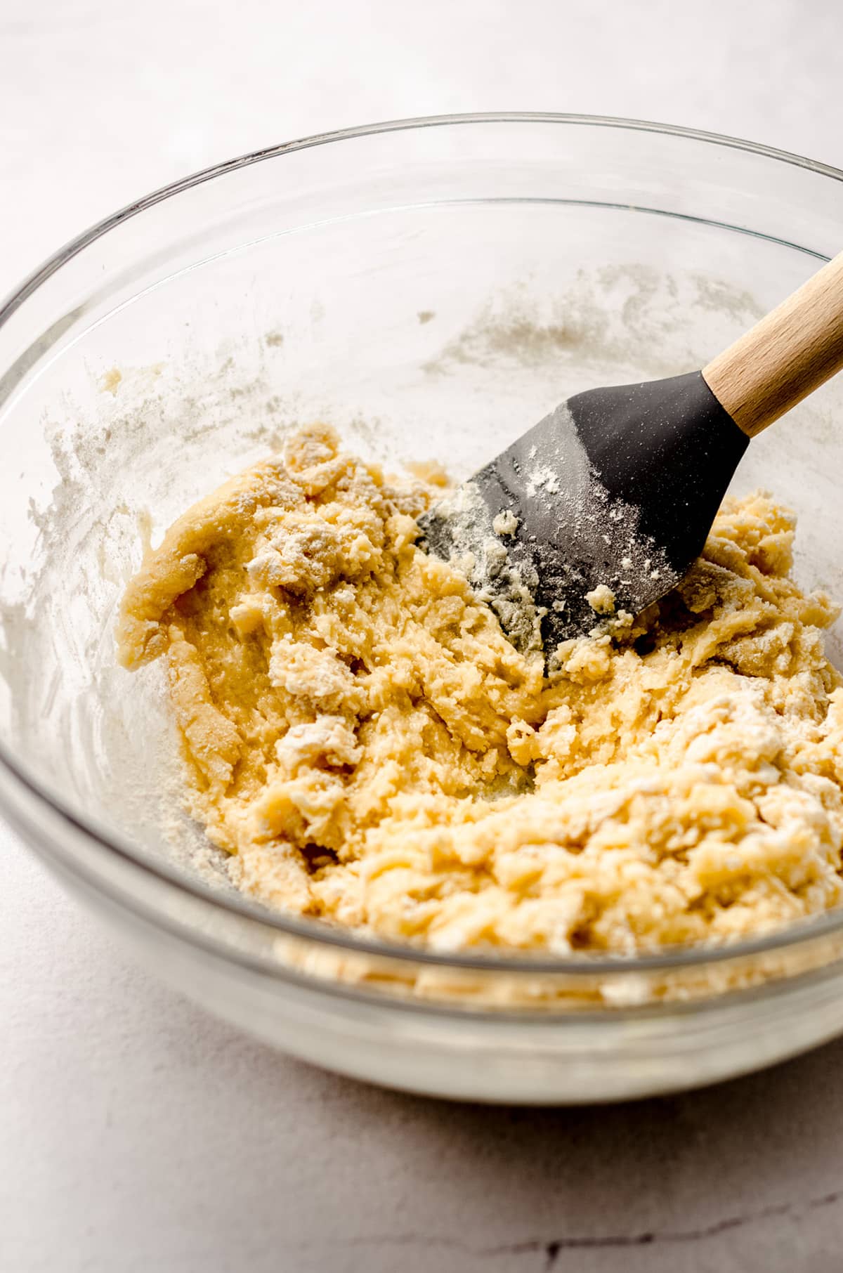 cookie dough in a glass bowl with a spatula