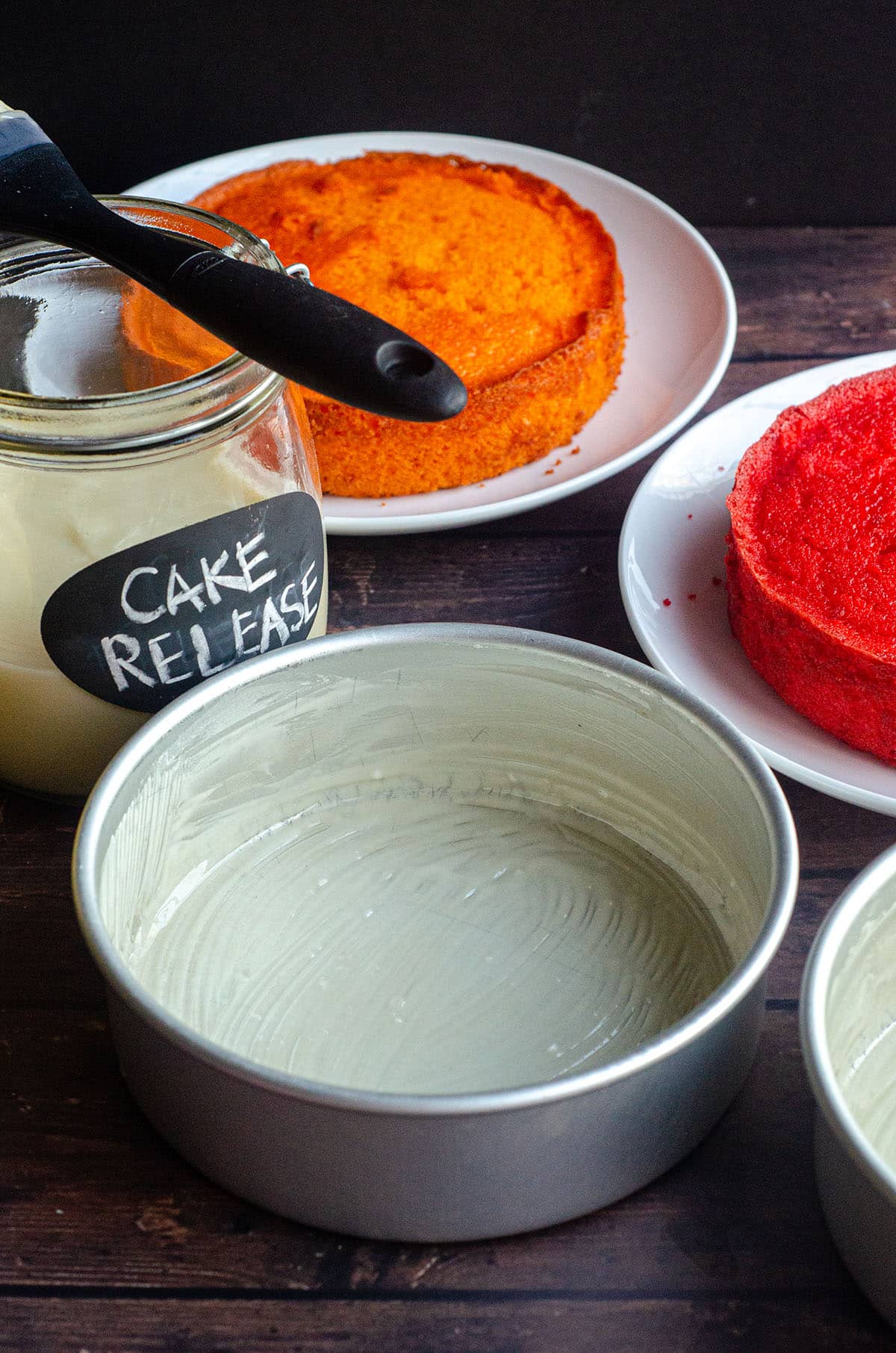 A cake pan with homemade cake release painted onto the inside of it. 