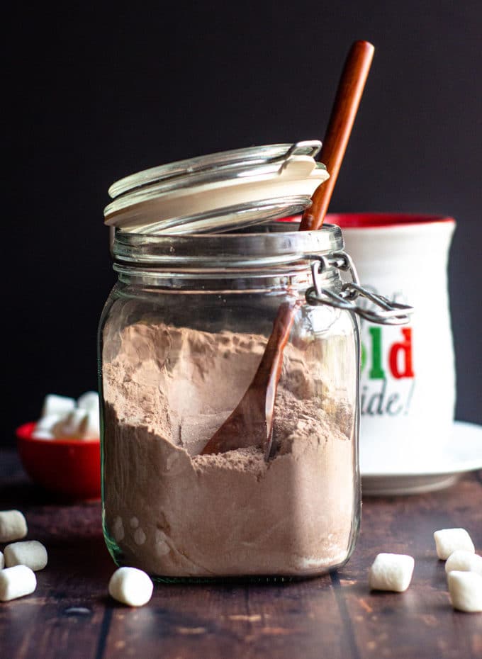 hot chocolate mix in a jar with a large spoon