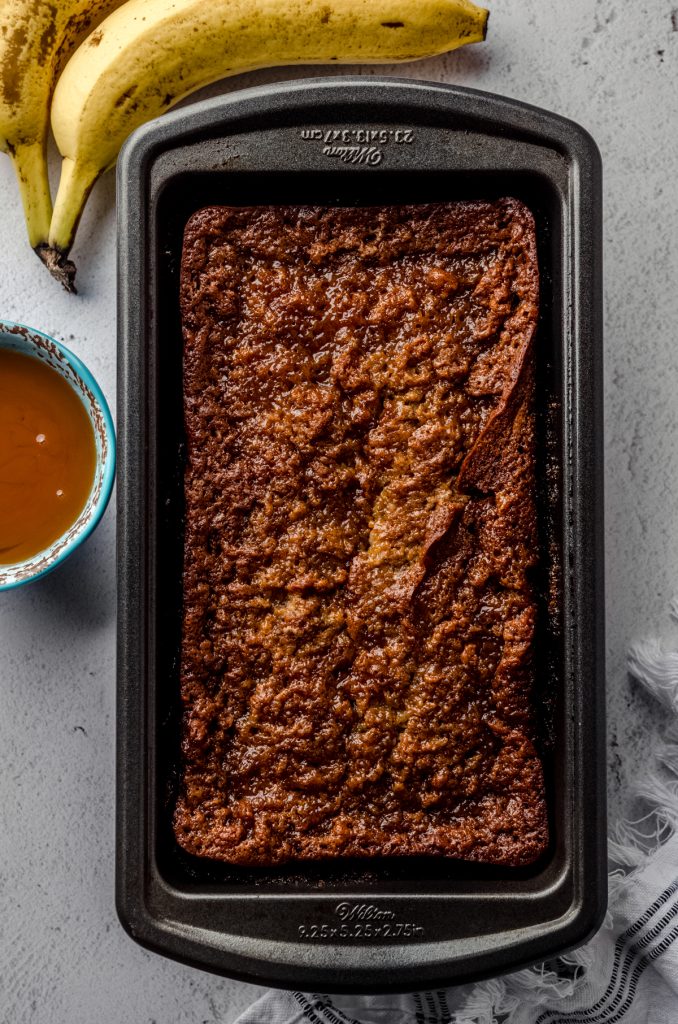 Aerial photo of a baking pan with salted caramel banana bread in it.