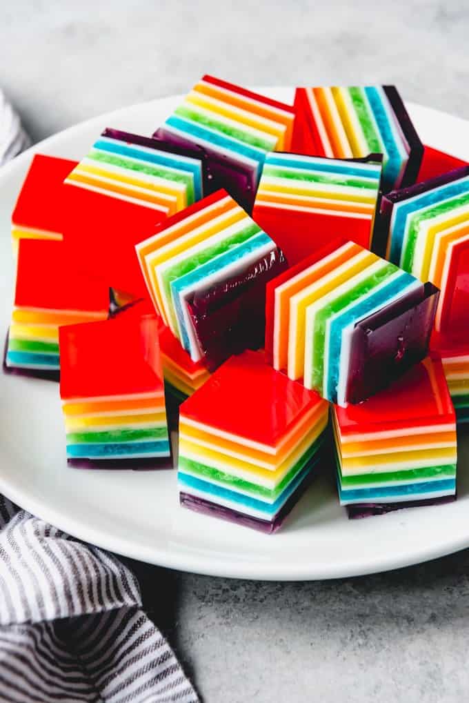 layered rainbow jello on a plate