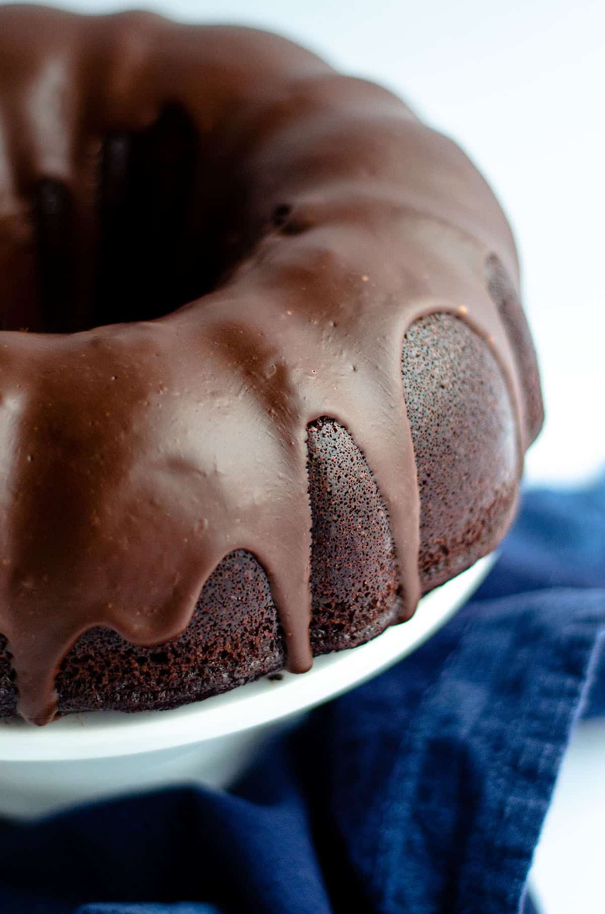 chocolate bundt cake on a cake stand