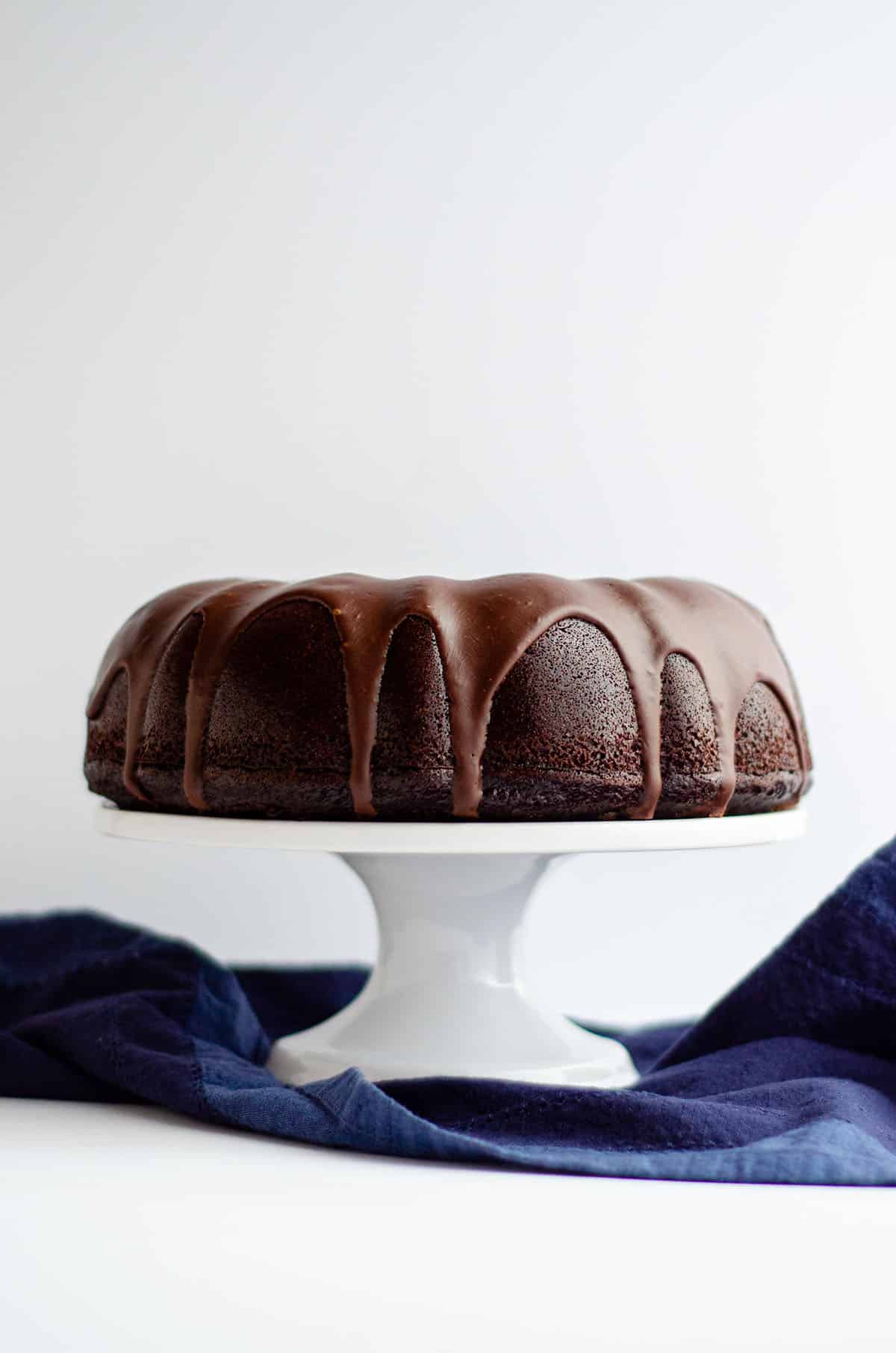 chocolate bundt cake on a cake stand