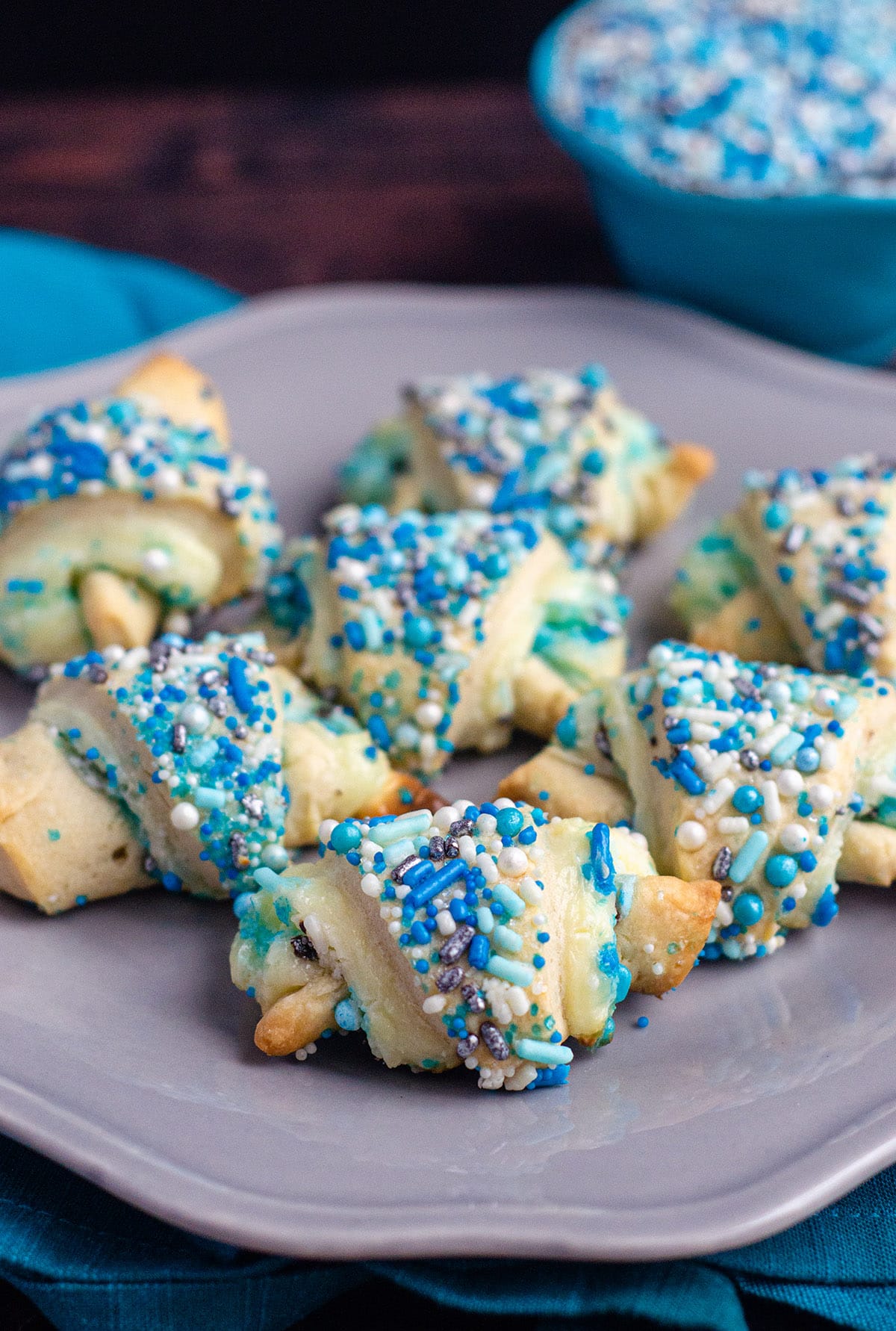 Basic rugelach filled with a sweetened cream cheese filling and plenty of sprinkles inside and out. via @frshaprilflours