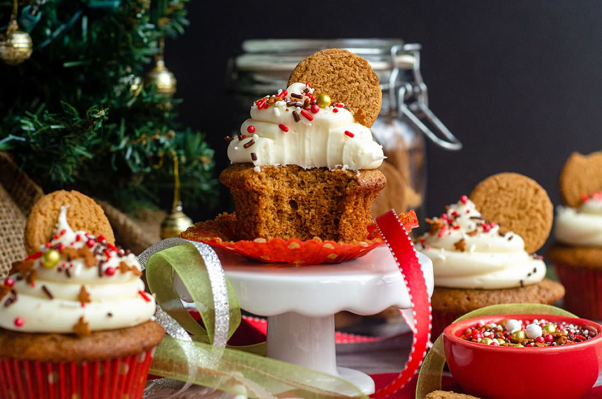 a gingerbread cupcake with a bite taken out of it