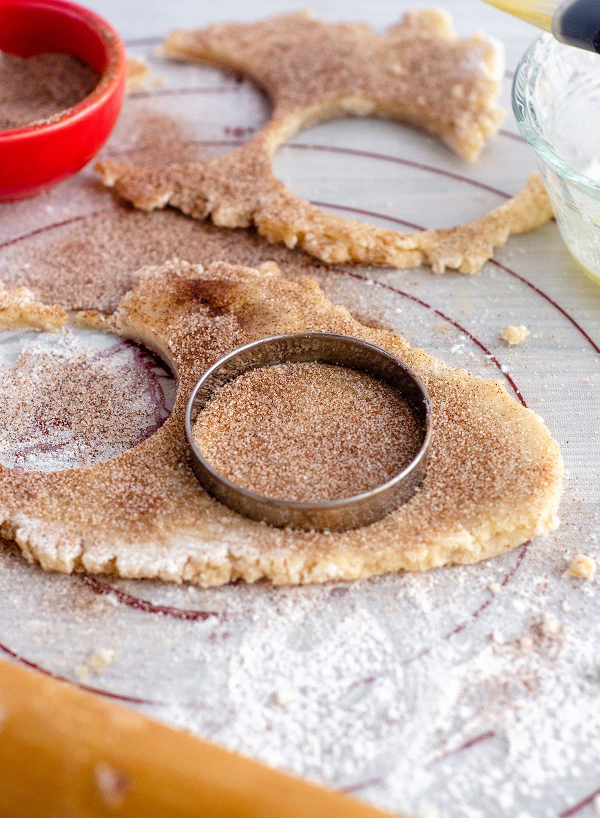 cookie cutter cutting out pie crust dough to make pie crust cookies