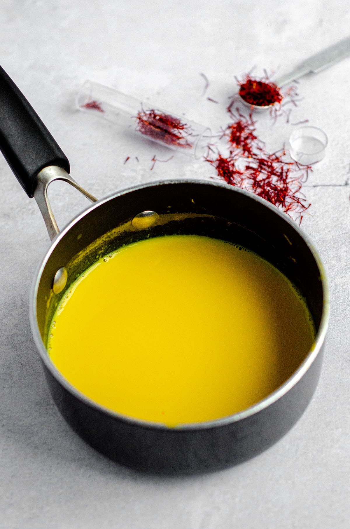 saffron-infused milk in a saucepan