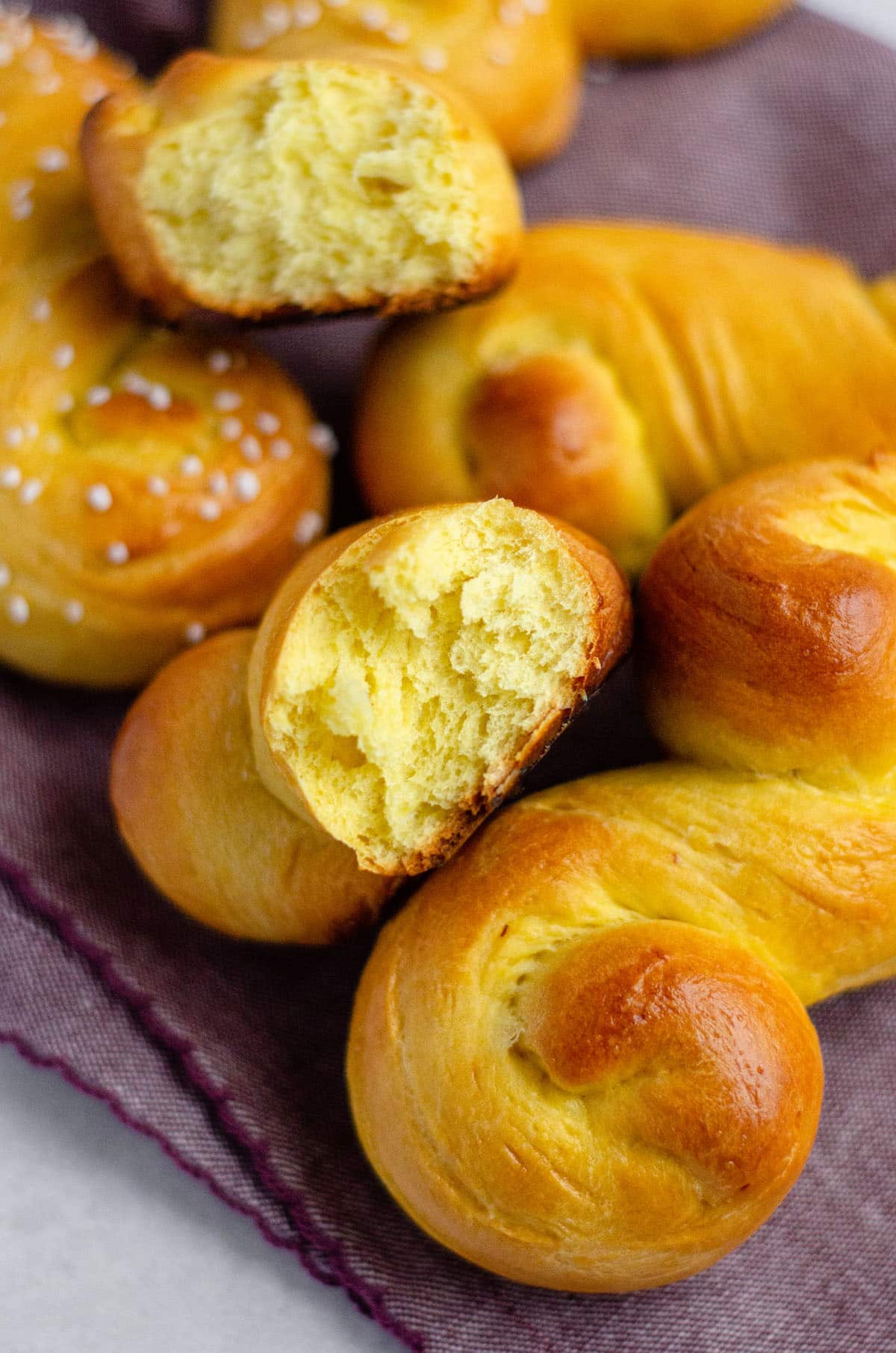 saffron bun torn apart to see the inside of the bread