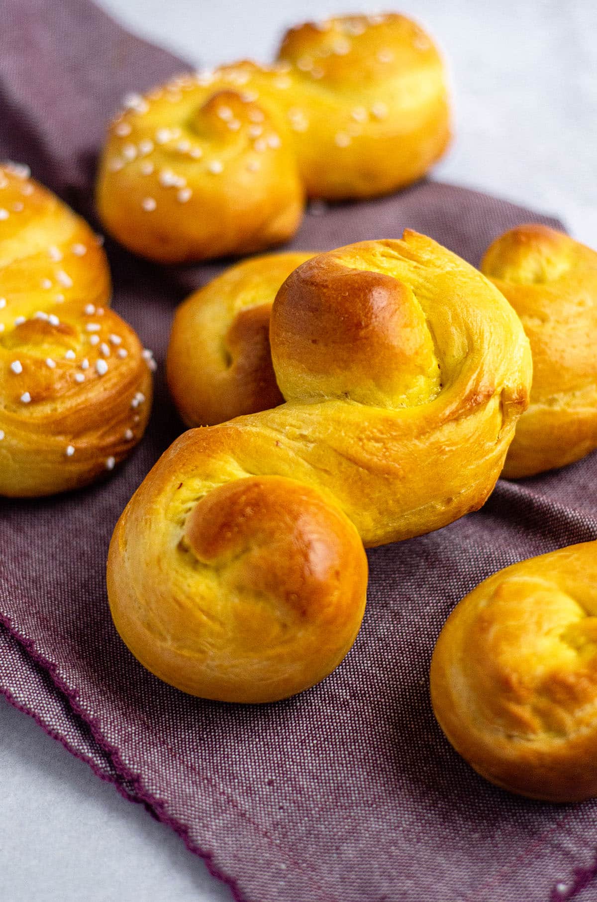 saffron buns on a purple kitchen towel