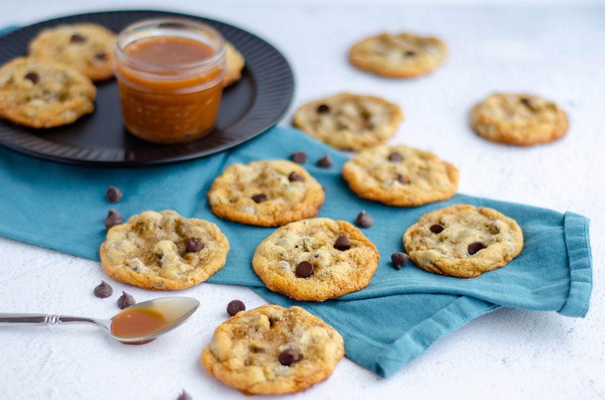 salted caramel chocolate chip cookies on a kitchen towel