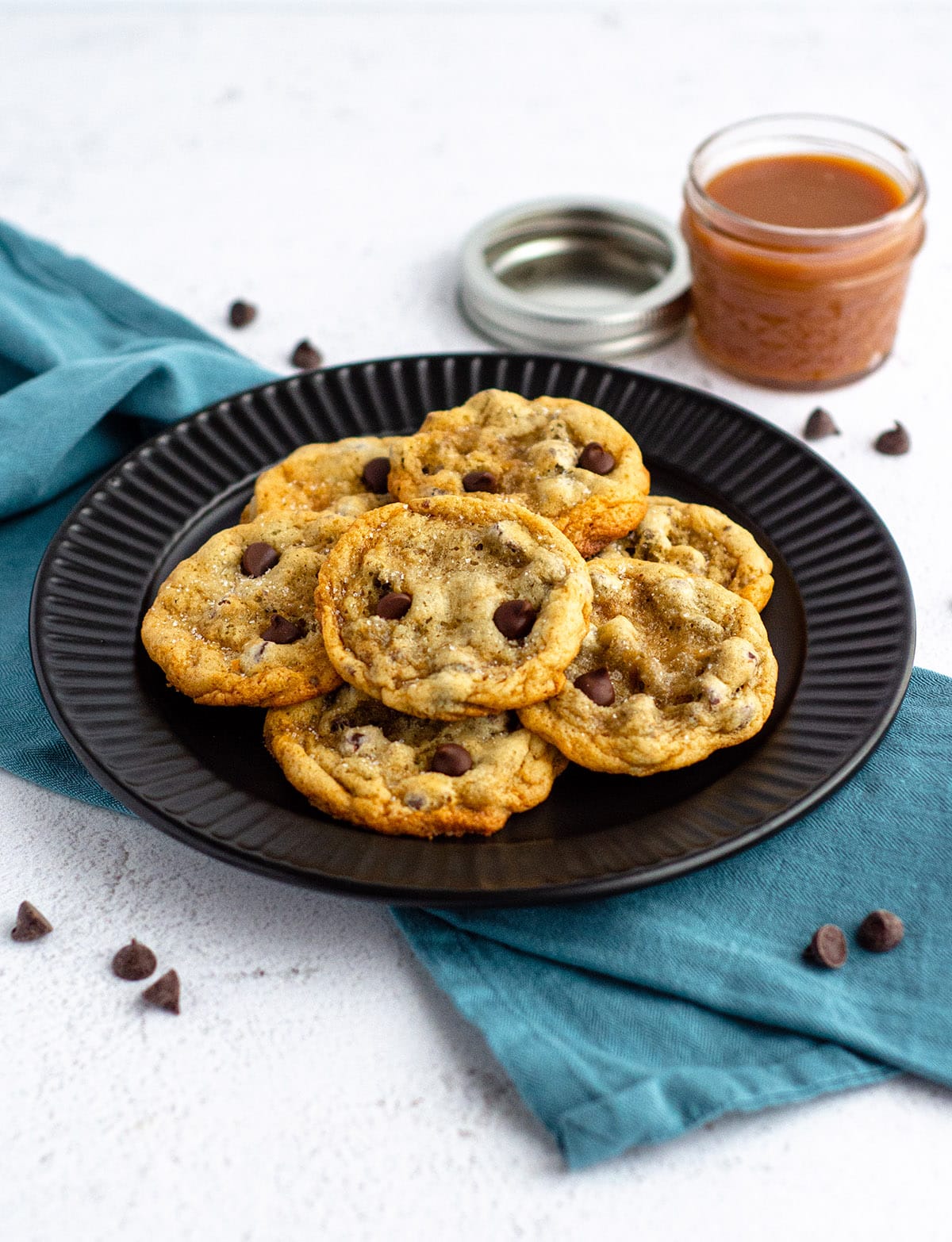 Salted Caramel Chocolate Chip Cookies: Easy drop cookies filled with chocolate chips and swirled with salted caramel sauce. No chilling required!